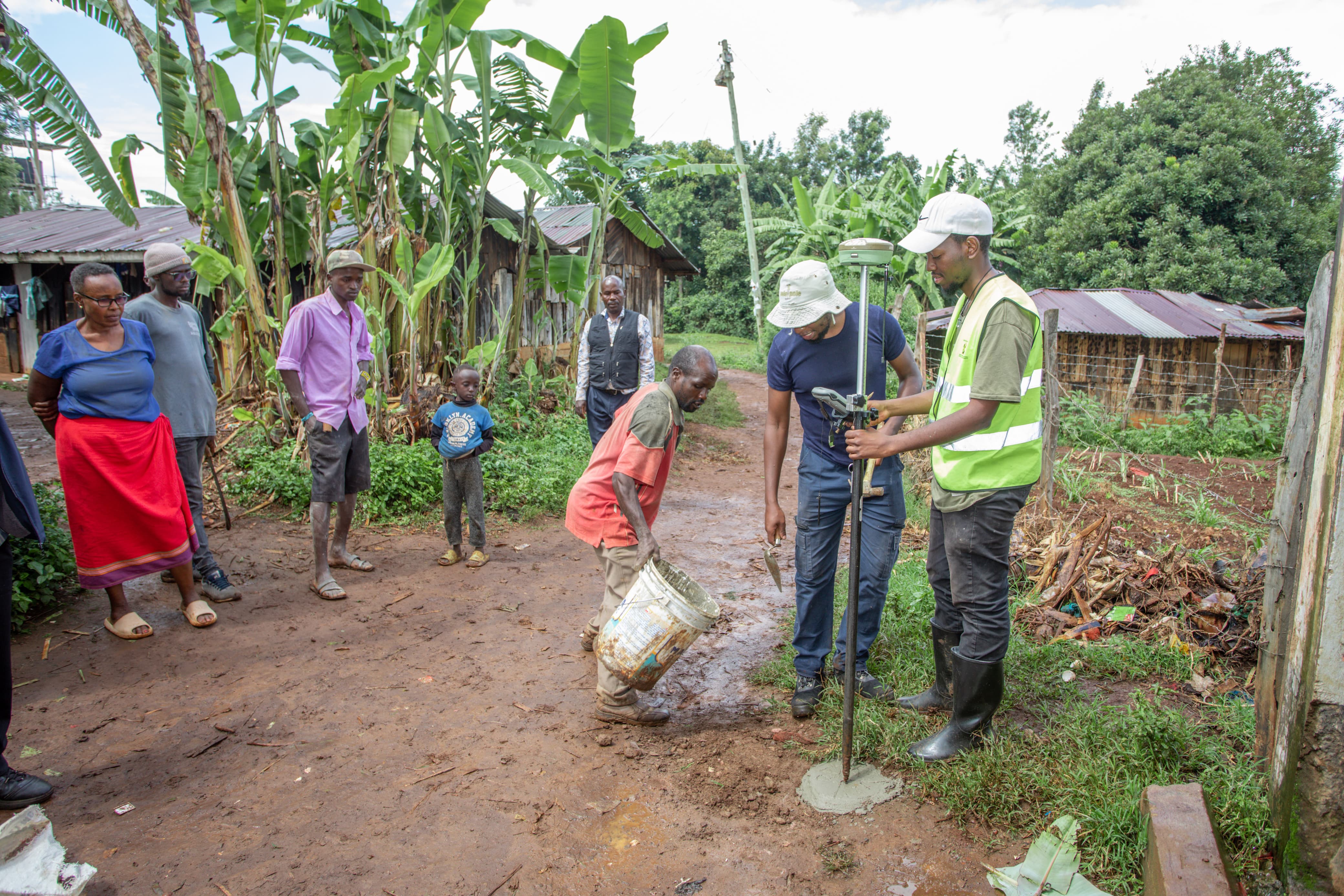Resident of the Ithareini village assist in marking the surveyed areas.