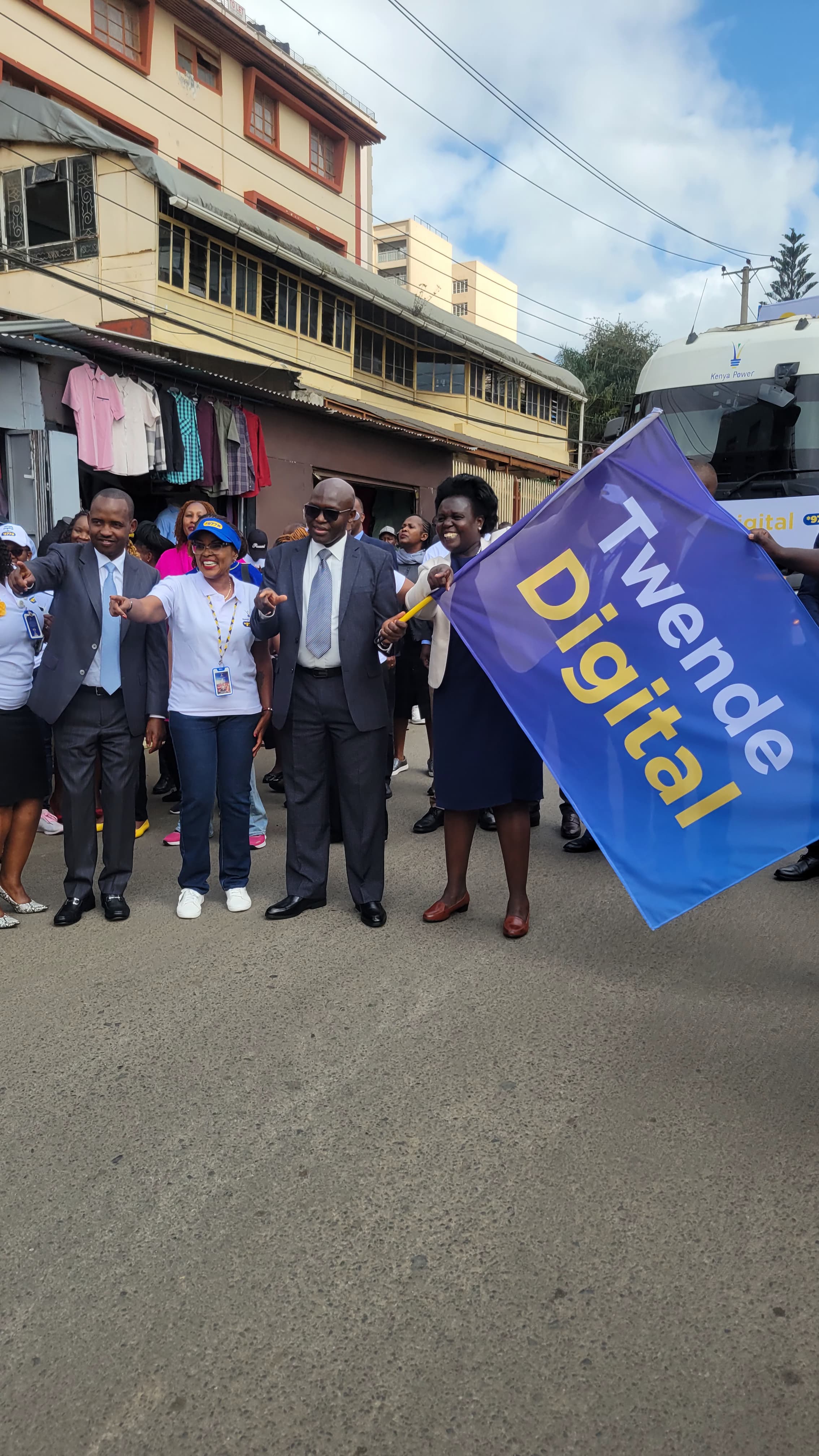 Acting Managing Director and CEO, Dr. Jeremiah Kiplangat (with flag), during the launch of the Twende Digital Customer Experience Roadshow in Nairobi, where he announced Kenya Power’s plans to fully transition to digital service delivery by 2027. Photo by Zipporah Odionyi.