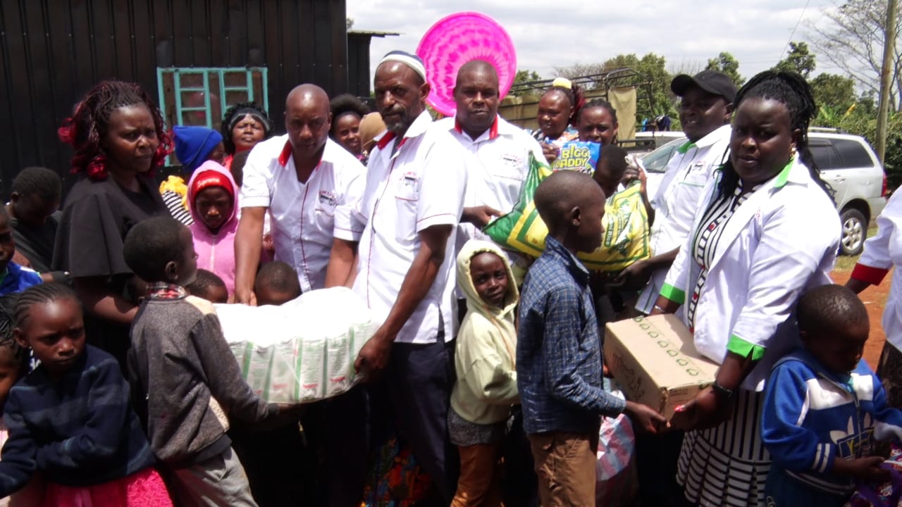 Cotton farmers from Kwale County receive pesticides from officials from a Thika Based Textile company, Thika Clothes Mill.
