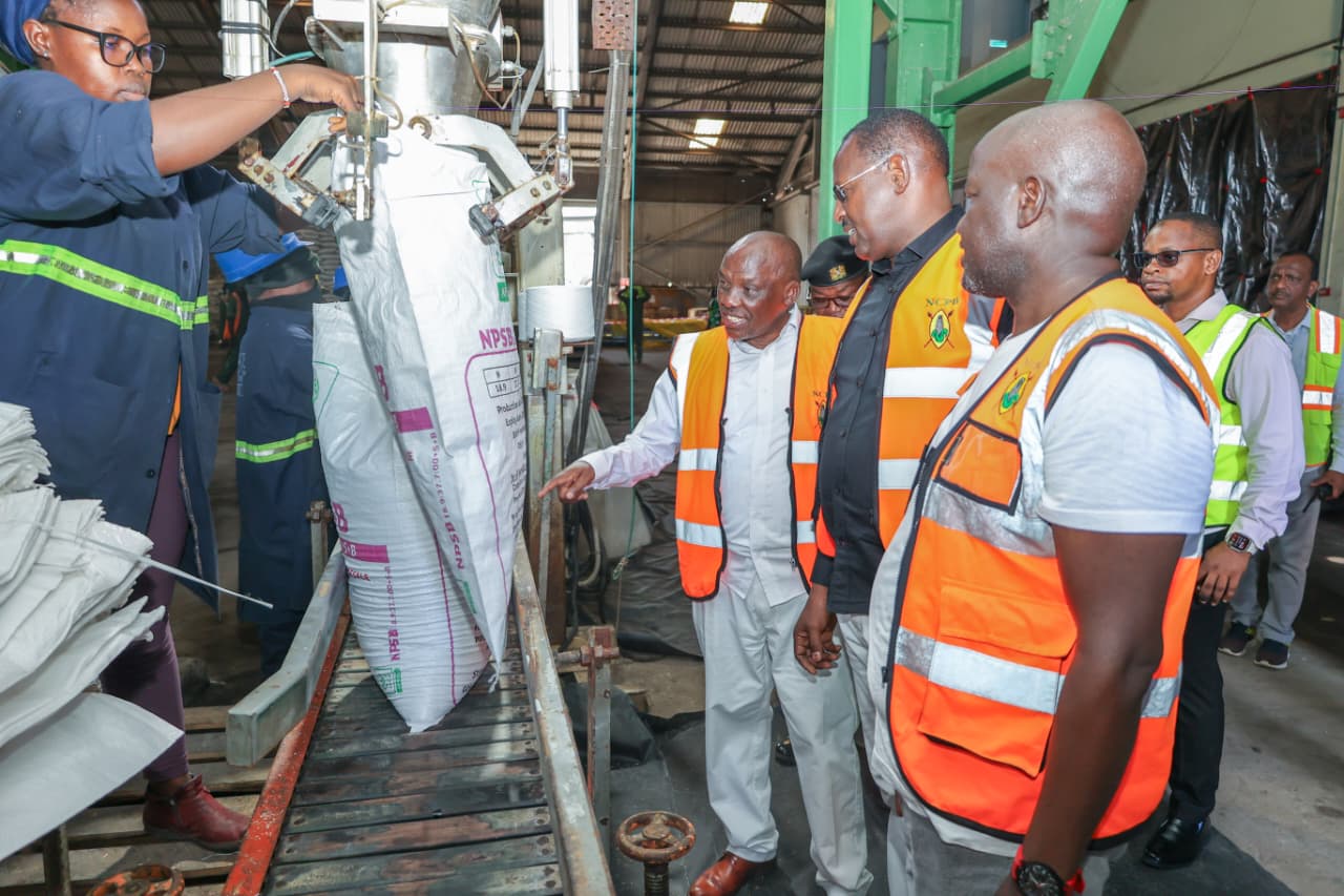  Principal Secretary (PS) for Agriculture Dr. Kiprono Rono (L) supervises the packaging of fertilizer after offloading at the Port of Mombasa. 