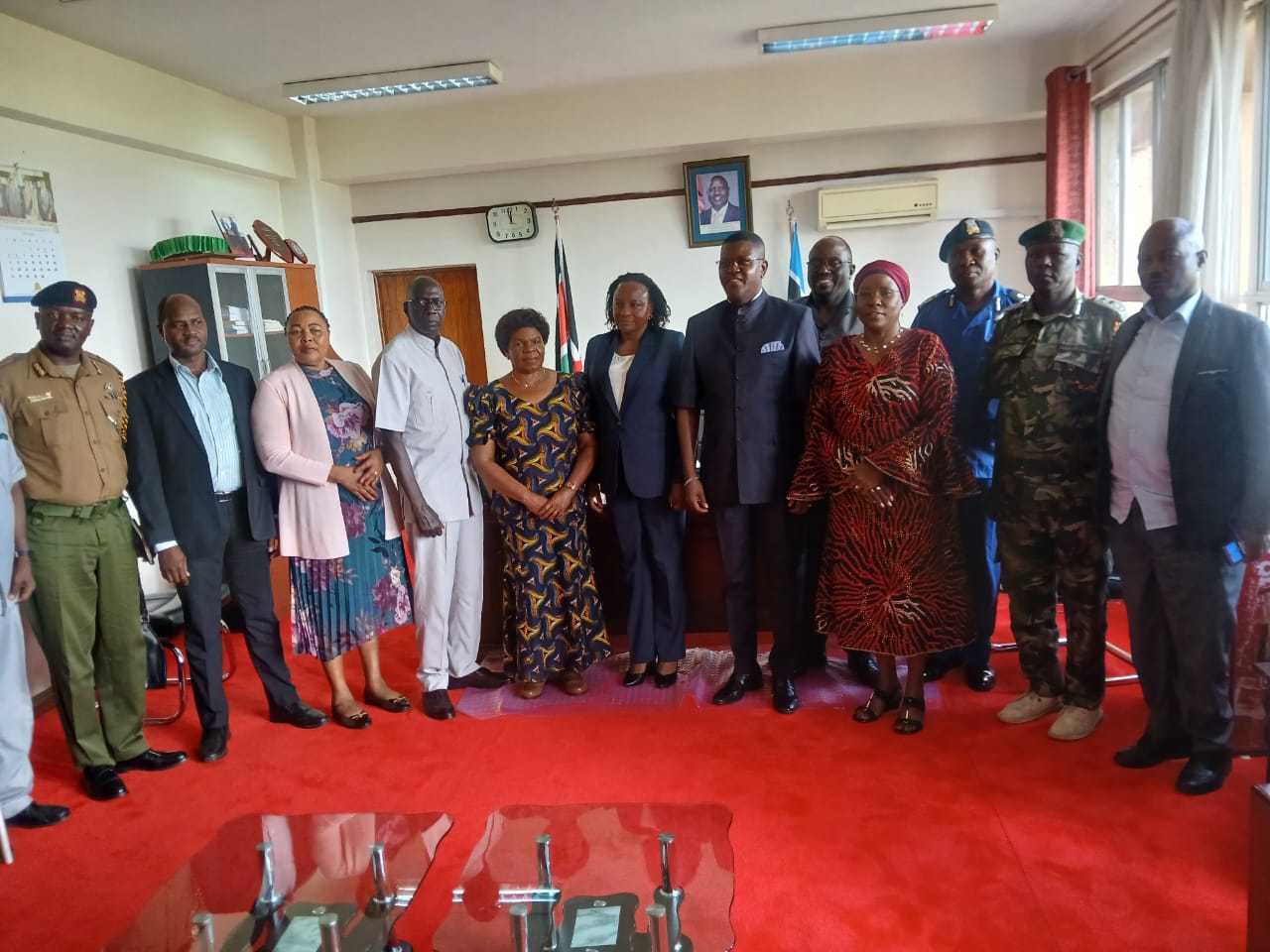 NPSC chairman Amani Yuda Komora (in Kaunda suit) during a courtesy call on Nyanza Regional Commissioner Flora Mworoa. PHOTO: VALARY NYAGAKA