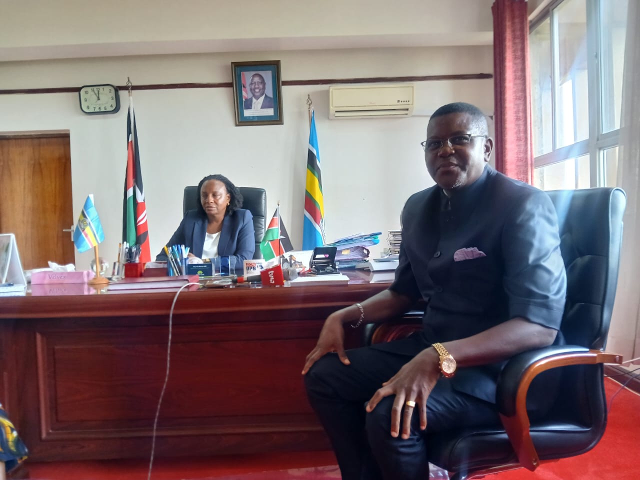 NPSC chairman Amani Yuda Komora (in Kaunda suit) during a courtesy call on Nyanza Regional Commissioner Flora Mworoa. PHOTO: VALARY NYAGAKA