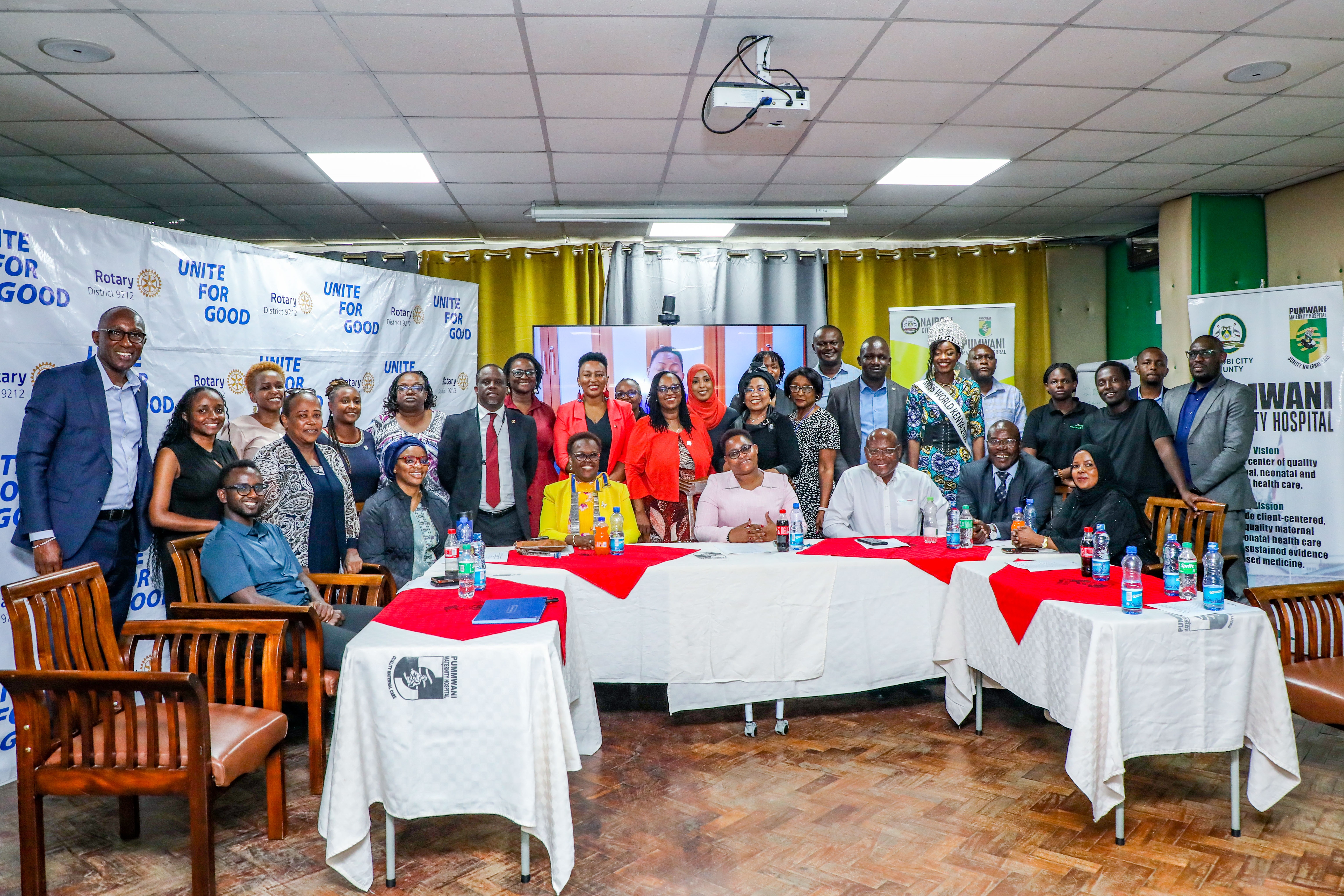 Representatives from M-Pesa Foundation, Nairobi City County Government, Rotary District 9212 and Pumwani Maternity Hospital pose for a group photo after the handover of equipment to the hospital’s newborn unit.