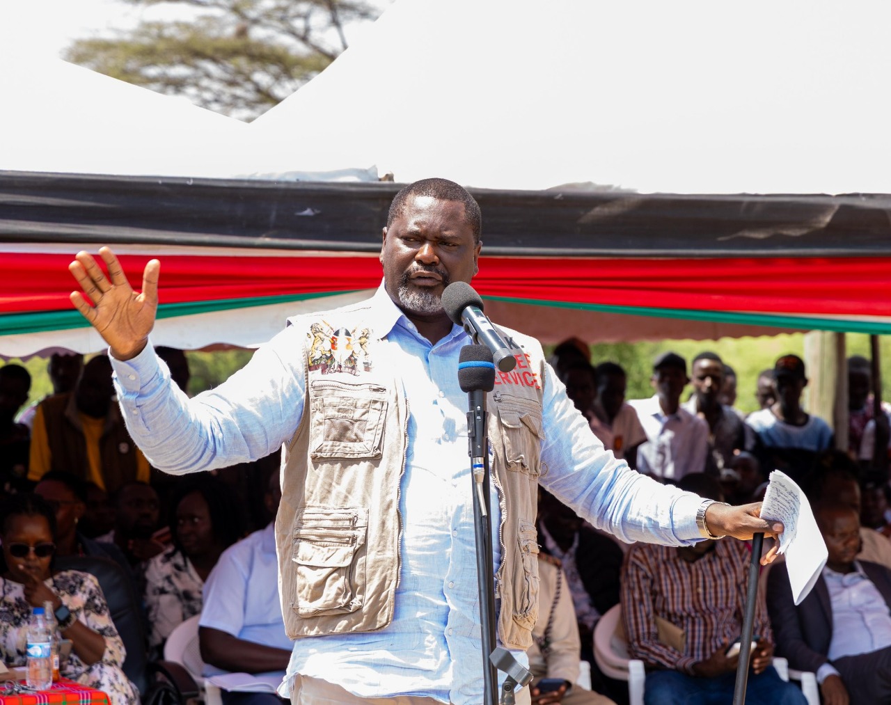 Cabinet Secretary for Public Servic,e Geoffrey Ruku, handing over foodstuffs to residents of Chemolingot, Tiaty Constituency during a government relief distribution exercise aimed at supporting vulnerable households.