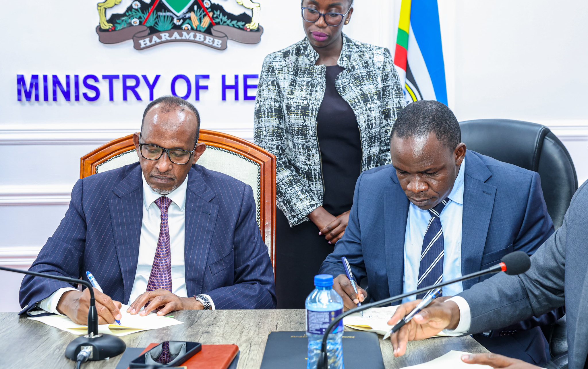 Health Cabinet Secretary Aden Duale, (left) and businessman Richard Ngatia signing a cooperation framework agreement that brings together national referral hospitals, the Social Health Authority, and the Digital Health Agency in Nairobi