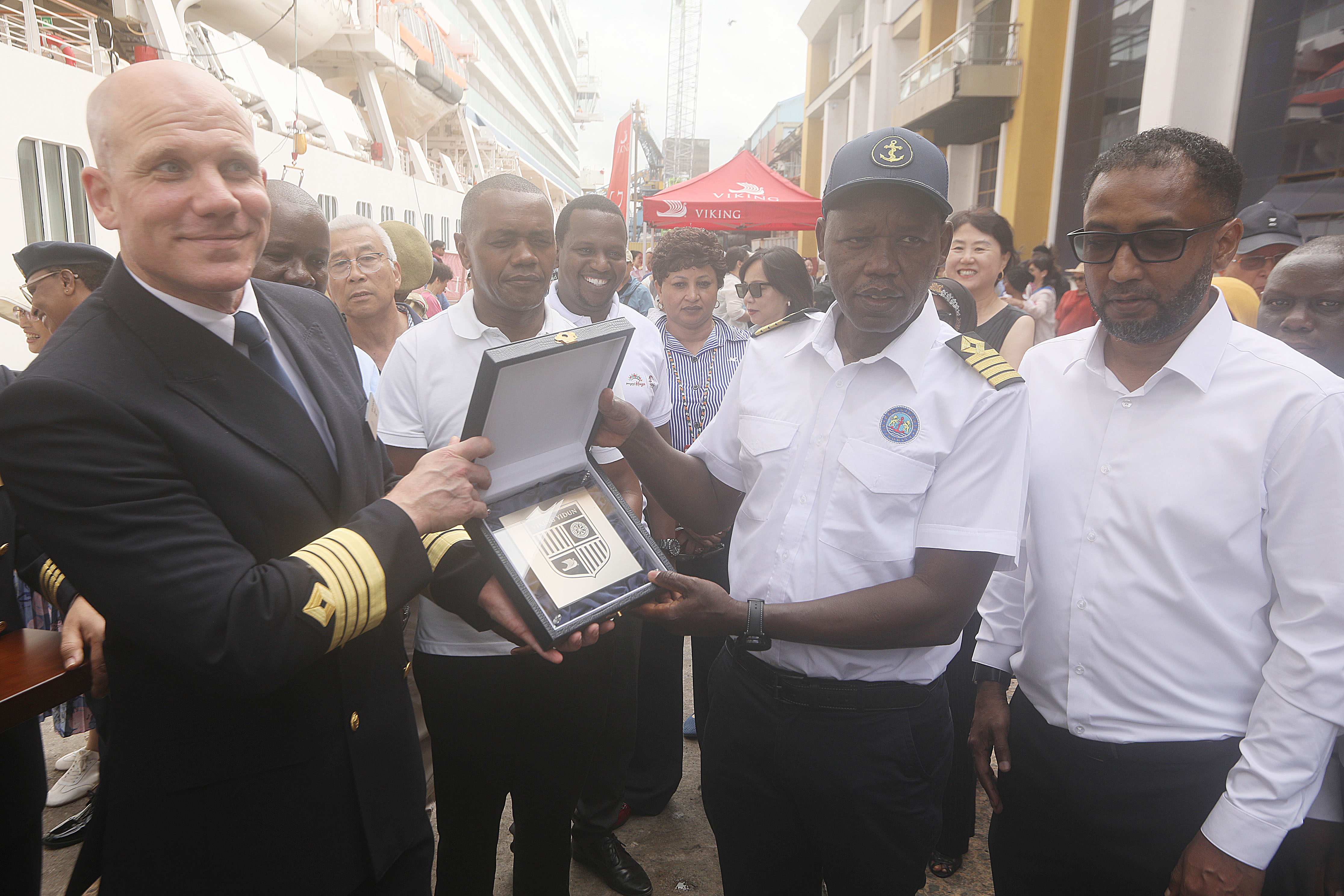 MS Viking Yi Dun vessel Captain Alex Sehlstedt (Left) receives a gift of first call from Kenya Ports Authority Managing Director Capt. William Ruto (second right). PHOTO: SADIK HASSAN/KNA