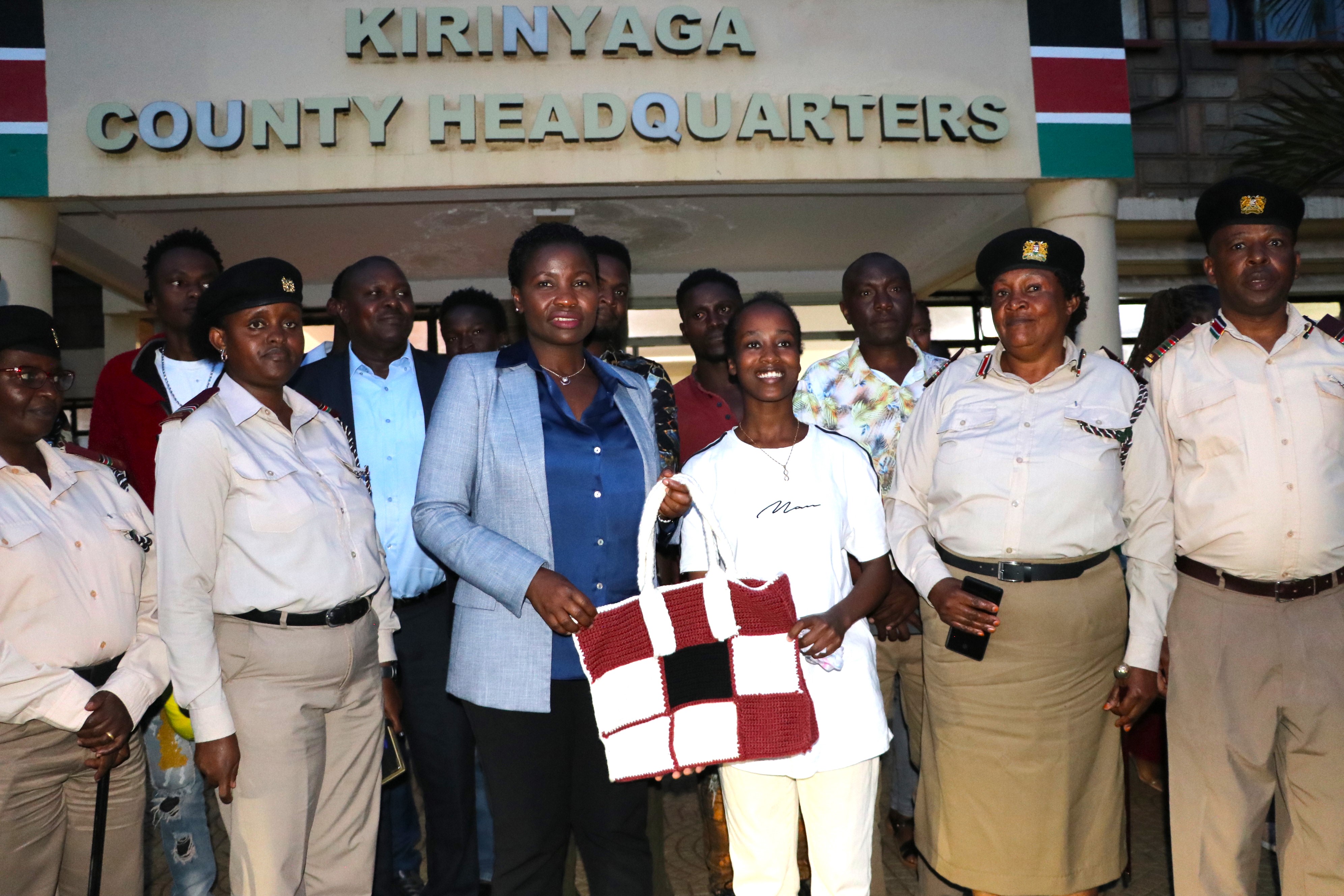 Principal Secretary, State Department of Micro, Small, and Medium Enterprises (MSMEs) Development Susan Mang’eni receives woven basket from NYOTA fund beneficiary