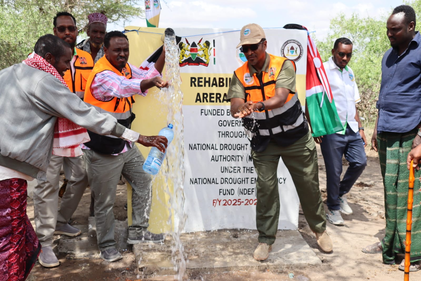 NDMA CEO Hared Adan (second right) and Garissa County Chief Officer for Water Mohamed Ibrahim (second left) jointly commission the rehabilitated Arera borehole in Shanta Abaq Sub-County.