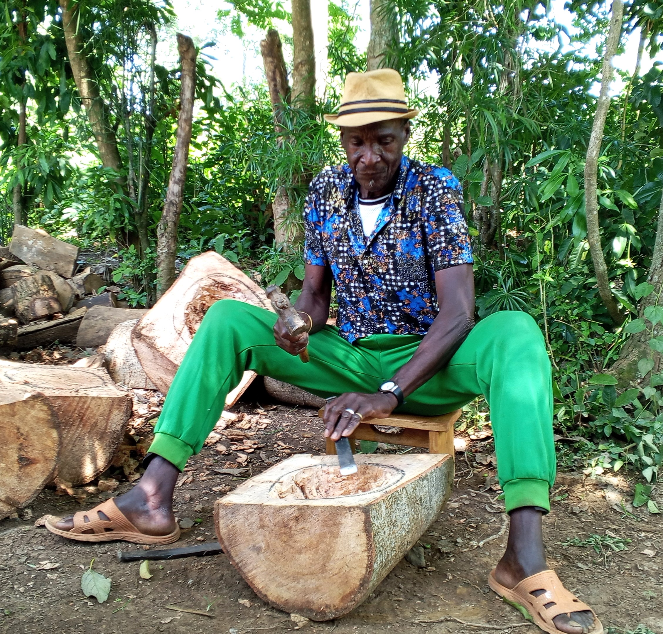  Charles Obong'o Mak'Omenda aka Obong'o Nyundo, at the initial stages of curving Nyatiti music instrument