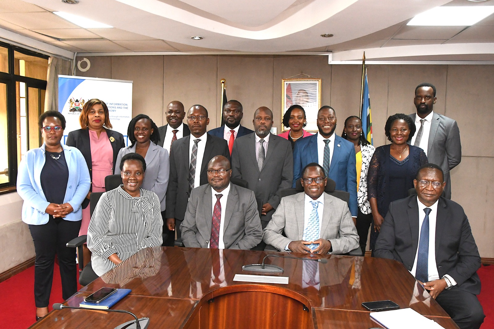 State Department for Broadcasting and Telecommunications Principal Secretary Mr. Stephen Isaboke (right) greeting Commissioner for ICT Infrastructure Development at the Ministry of ICT & National Guidance in Uganda and Uganda Communications Commission (UCC) Board Member Eng. Geoffrey Agoi. Photo by Cheptumo Kibet.