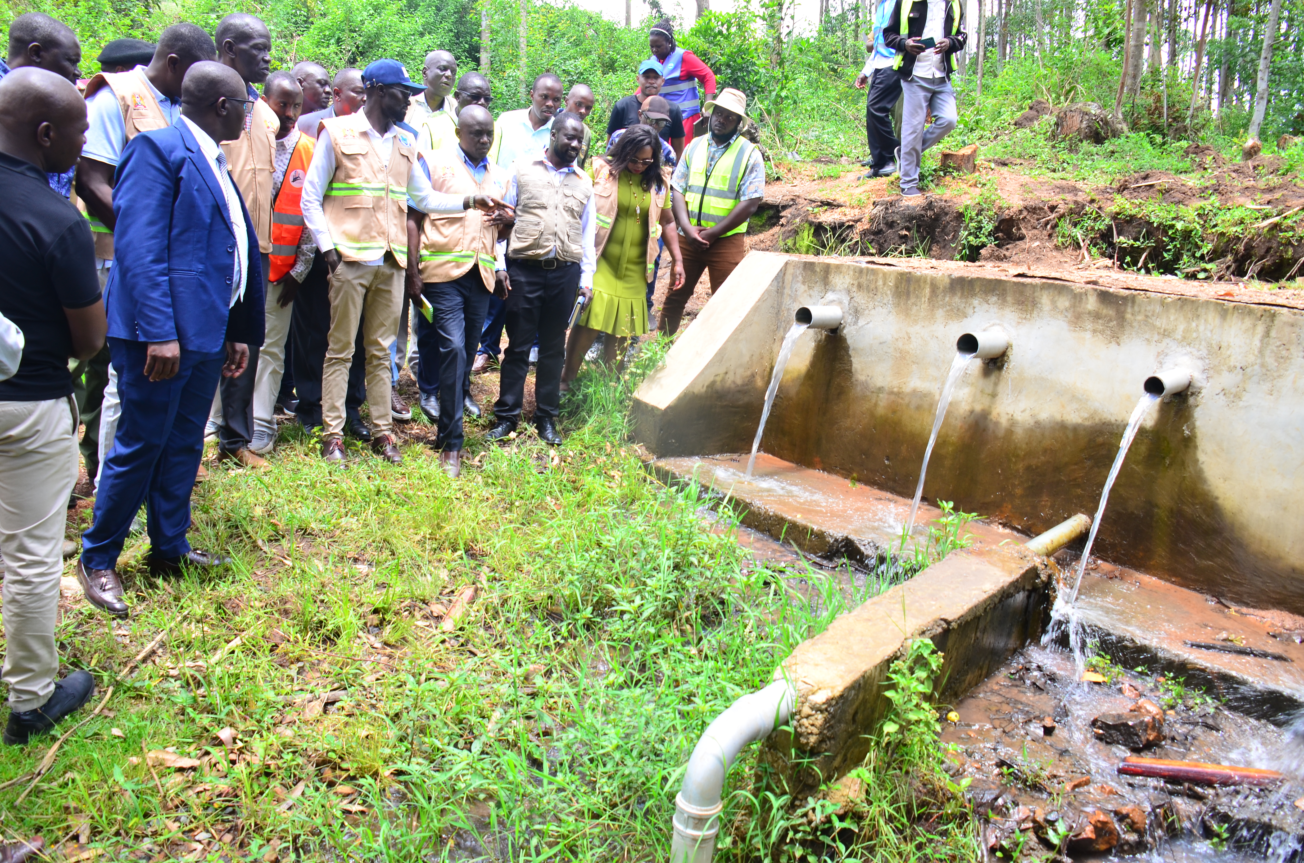 Cabinet Secretary for Water, Sanitation and Irrigation Engineer Eric Mugaa (in cap) at a water point; for the Kegango Cluster water and Sanitation project ( lot 1-Nyamanche water supply) in Kuria East Sub-County. The CS commissioned the water project that is meant to serve about 3,700 households in Kegonga town and the surrounding areas of Nyabasi East Ward.