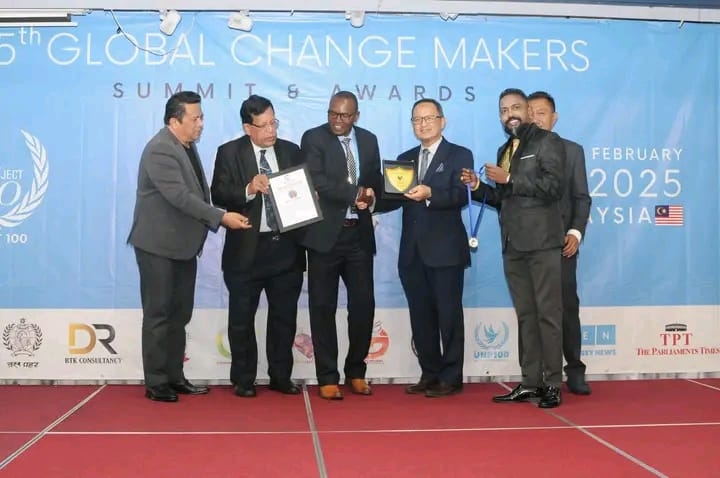 Julius Mwenda a Machakos Policeman as he receives his 5th Global Change Makers award in Malaysia Kuala Lumpur for his contribution to the Environment with honor.