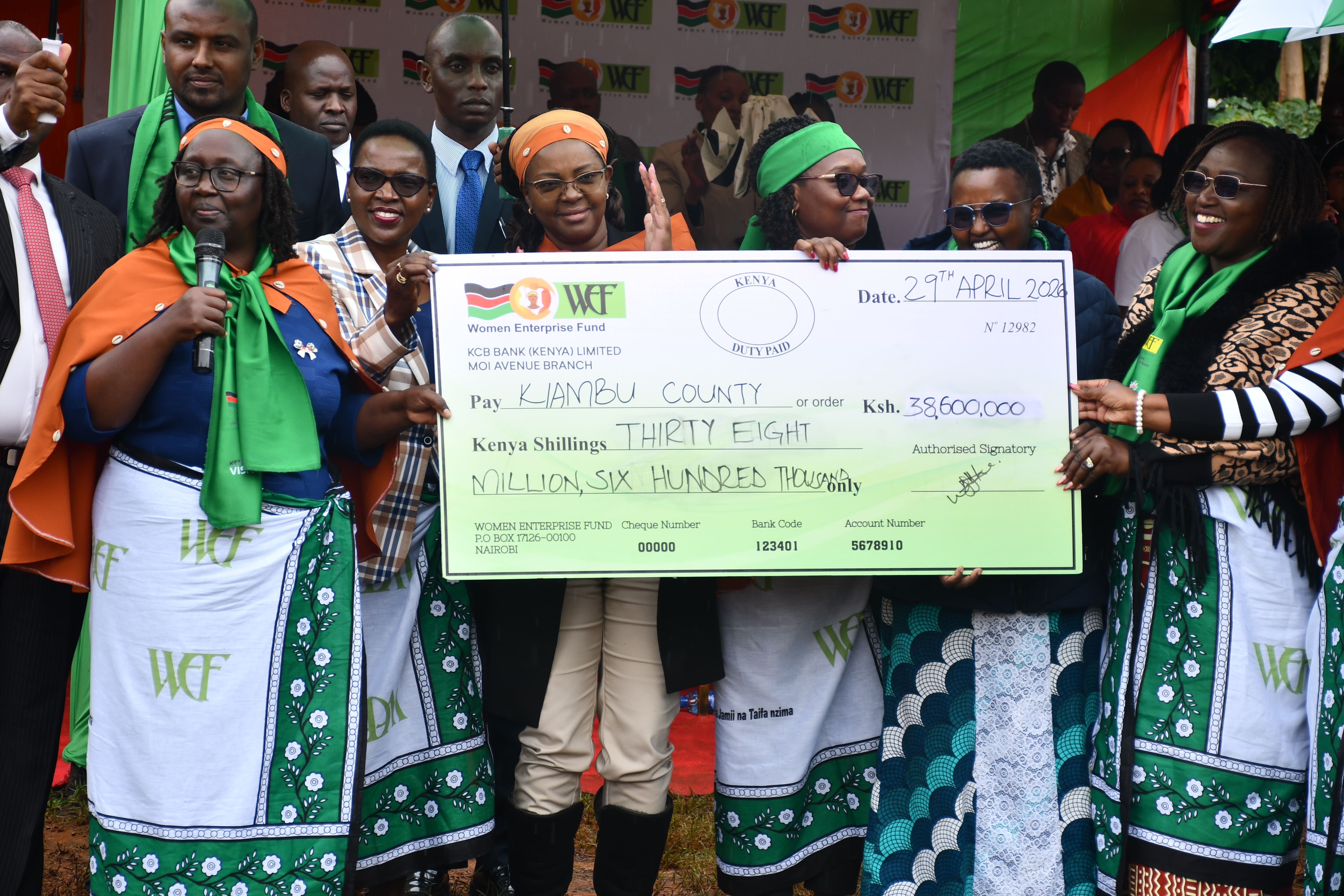 Gender CS Hanna Cheptumo presents a cheque worth Sh38.6 million to representatives of women groups at the Kiambu Women Empowerment Forum.