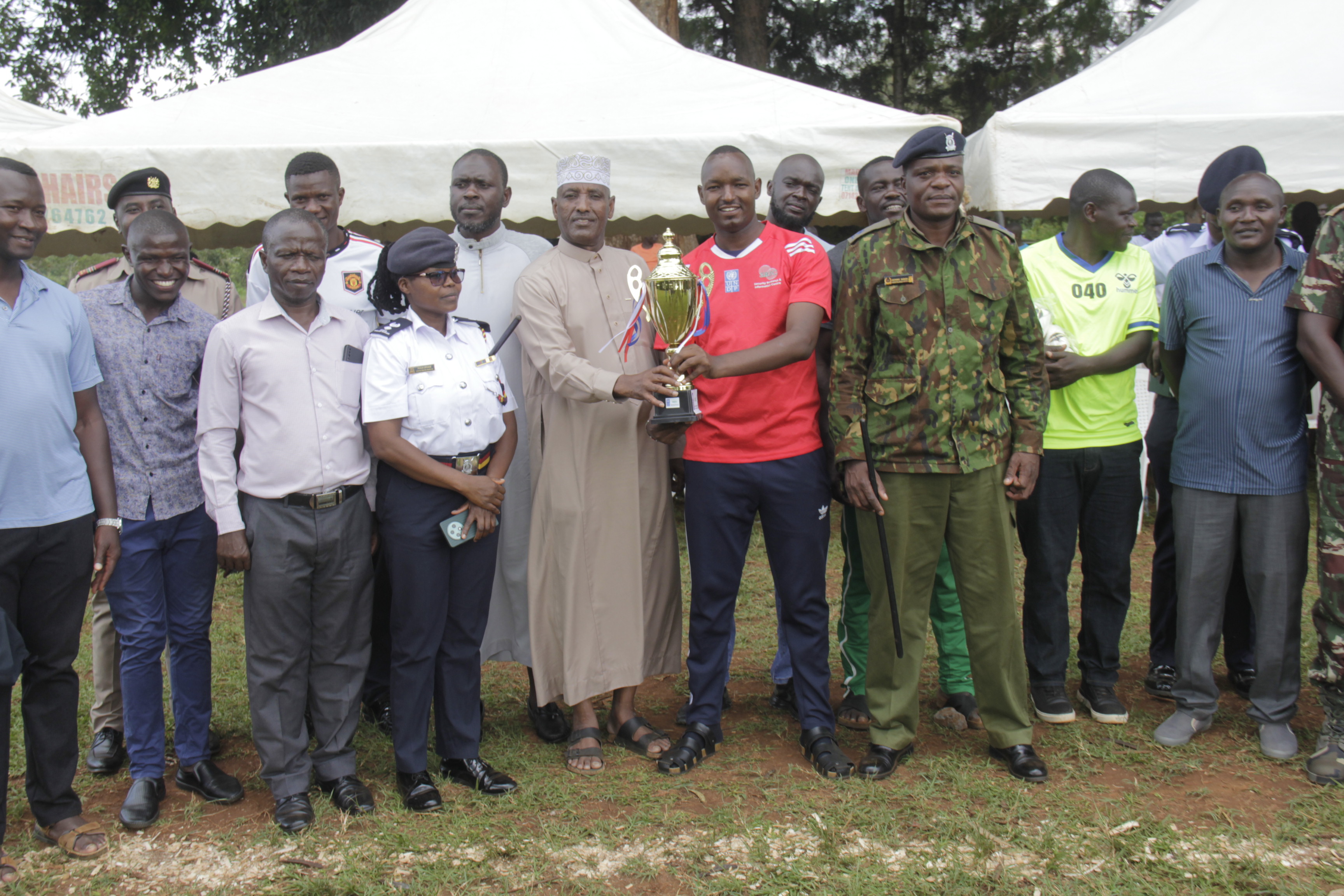 Police officers from Busia central police station (in red jerseys) during the football match with the members of the public at St Marys Mundika Boys High School. The match is part of the initiative that aims at strengthening the relationship between police and community for security purposes.