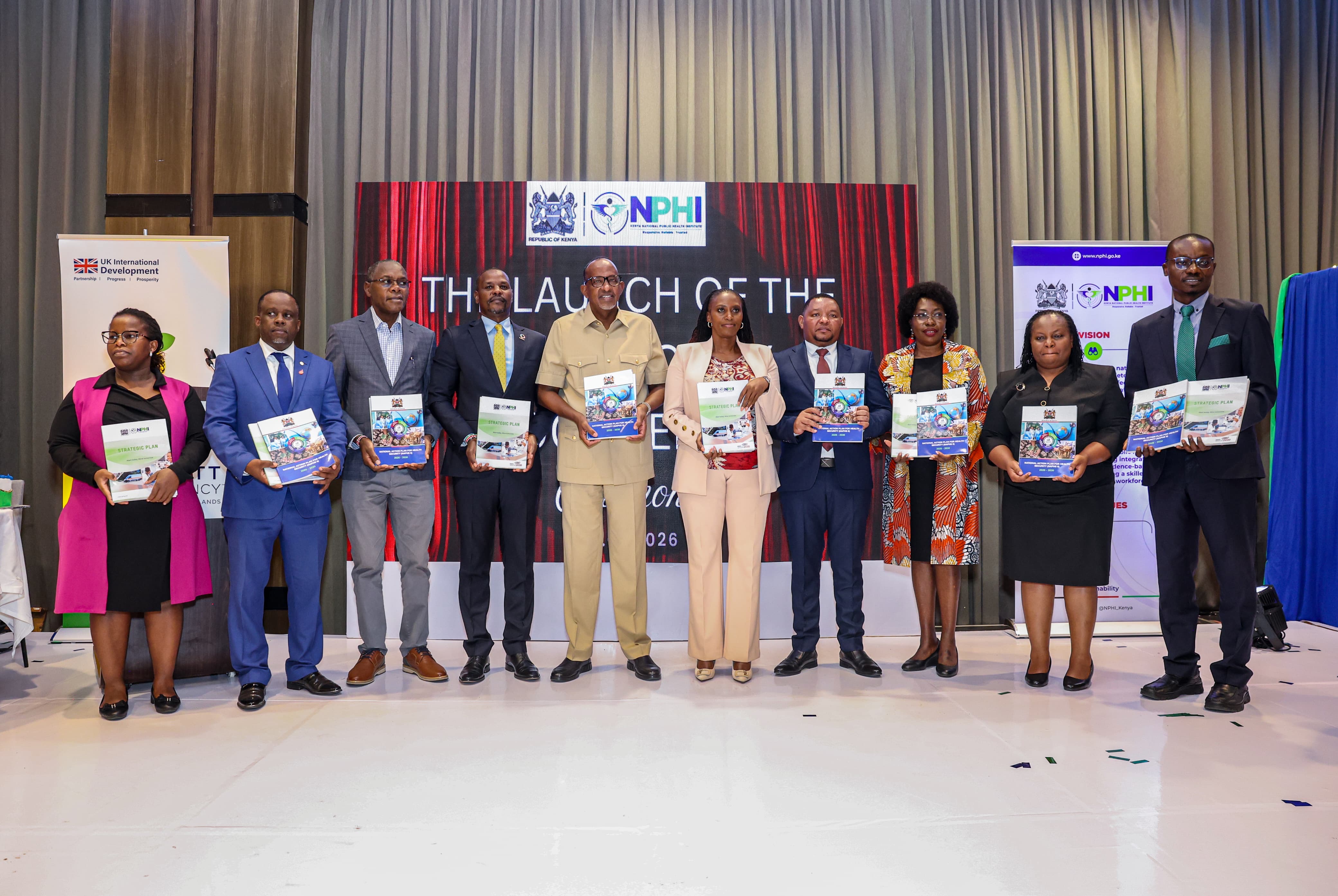 Mary Muthoni, Principal Secretary for Public Health and Professional Standards; Festus K. Ng’eno, Principal Secretary for Environment and Climate Change; Neema Rusibamayila Kimambo, WHO Acting Country Representative; John Kariuki, Chairperson of the Kenya National Public Health Institute Board; Kamene Kimenye, Acting Director-General of the Kenya National Public Health Institute; alongside representatives from Africa CDC, development partners, and stakeholders from national and county governments.