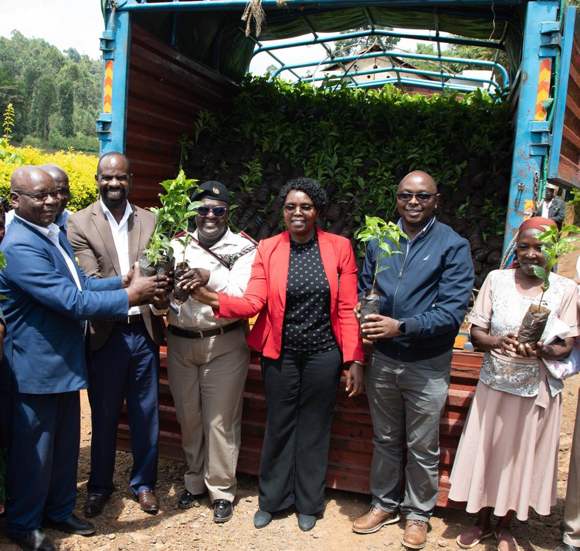 Second from Left, New KPCU MD Timothy Mirugi joined by Henry Kinyua (second from right), member of National Coffee Revitalization steering committee in Kenya, during a distribution exercise.