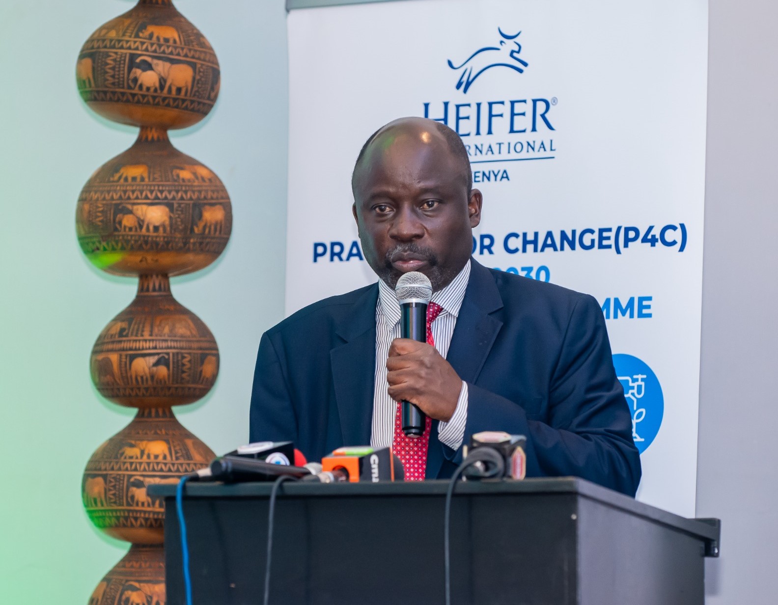 Dr. Christopher Wanga, Director Livestock Policy Research and Regulation, Ministry of Agriculture Livestock Development, delivering the speech by Agriculture CS Mutahi Kagwe during the launch of heifers Kenya signature program framework.