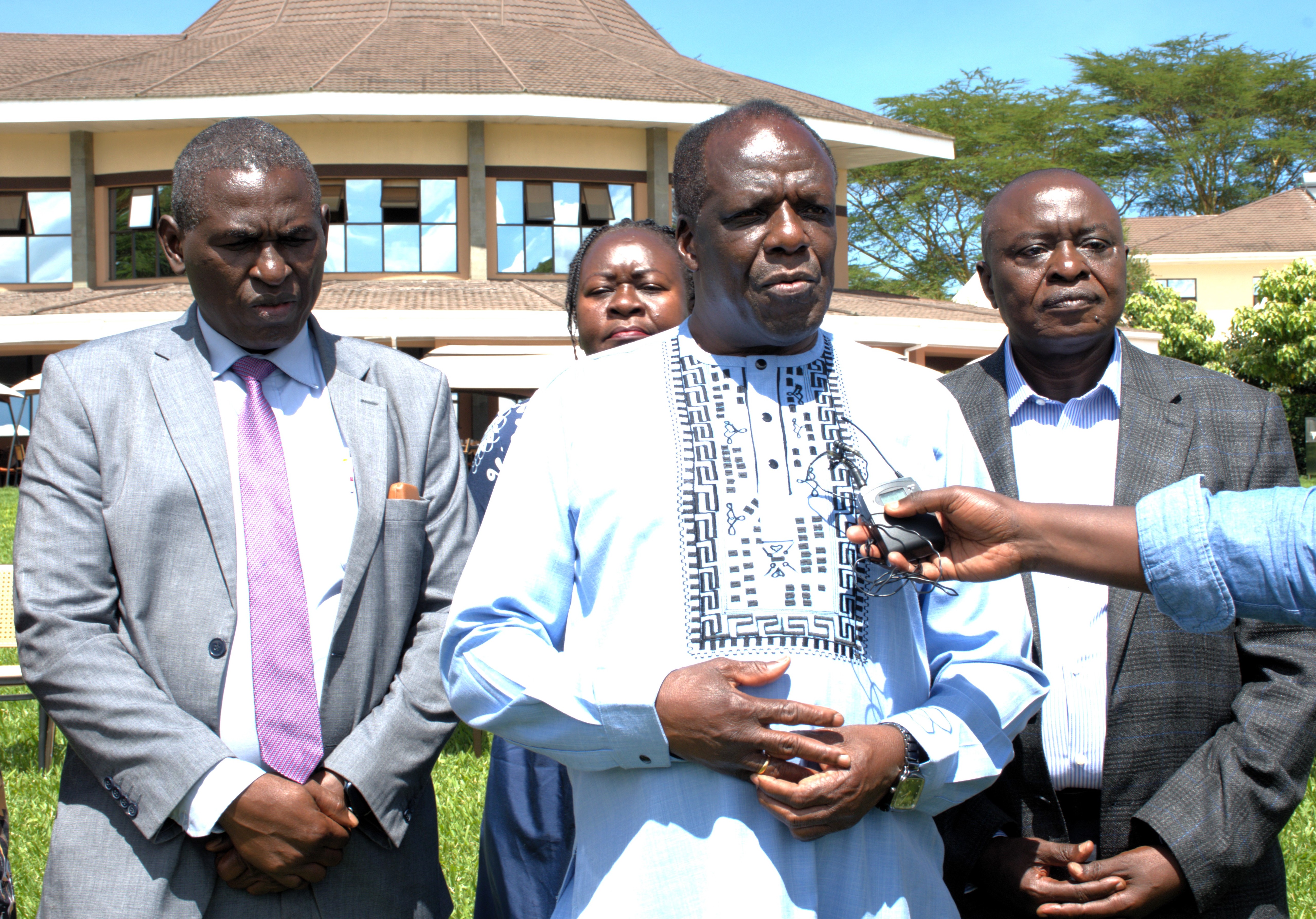 Commissioner for Co-operative Development David Obonyo, Cabinet Secretary for the Ministry of Co-operatives and Micro, Small, and Medium Enterprises (MSME) Development; Wycliffe Oparanya; and Cooperative Alliance of Kenya (CAK) Chief Executive Daniel Marube are speaking to the media on cooperative reforms. Behind the CS is the County Director of cooperatives for Nairobi County Dolphine Aremo
