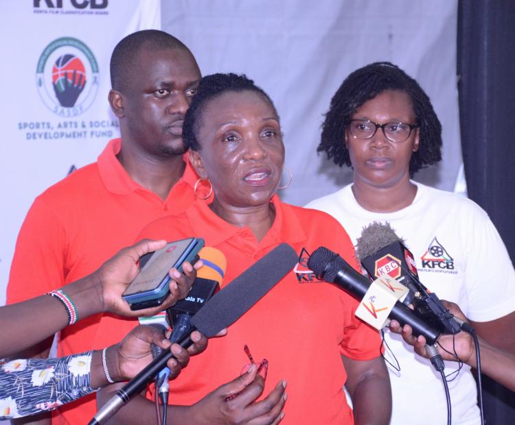 Ms Nelly Muluka,KFCB's Chief Manager for Corporate Services and Administration  flanked by Mr. Marcos Masiga, the Acting Manager for Licensing and Ms  Josephine Gitiri , KFCB's  Western Regional Head in a press briefing  during a press briefing during a stakeholder  engagement forum for creatives in Kisumu