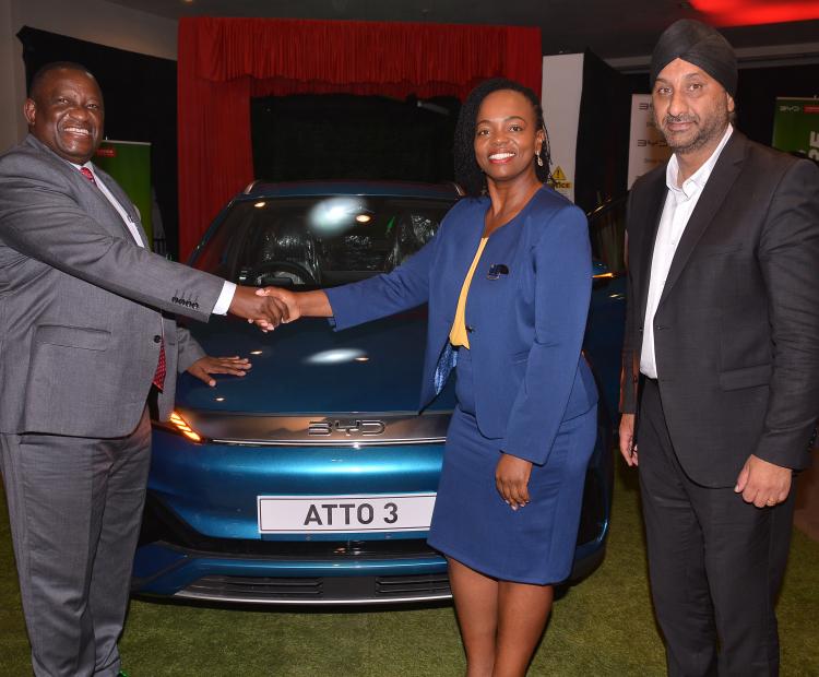 Cabinet Secretary for the Ministry of Investments, Trade & Industry, Salim Mvurya (left), Loxea Kenya Managing Director, Jennifer Kinyoe (centre) and CFAO Mobility Group CEO, Arvinder Reel (right) launch BYD Atto 3 at the new BYD showroom on Uhuru highway.