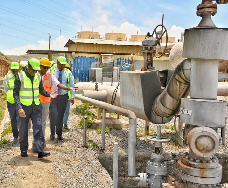 Energy and Petroleum Cabinet Secretary Hon. Opiyo Wandayi (left) , joined by the ministry office, inspects a geothermal wellhead during his official familiarization tour of geothermal- rich Olkaria area in Naivasha weeks ago. Photo/Erastus Gichohi.