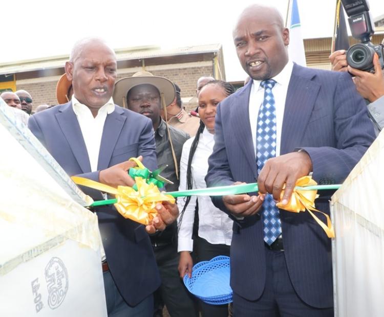 Agriculture CS Dr Andrew Karanja (L) and Bomet Governor Prof Hillary Barchok (R) launched the distribution of 14 pyrethrum dryers to farmers