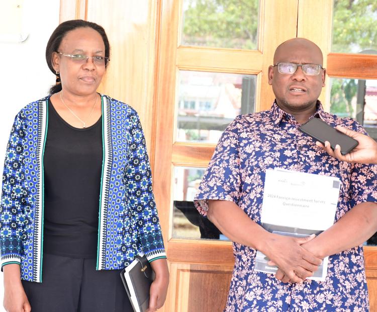 Director Statistical Coordination and Methods at KNBS, Benjamin Avusevwa (R) addresses the press during the closing ceremony of a 10-day training of research assistants in Kisumu County. Photo/Robert Ojwang’