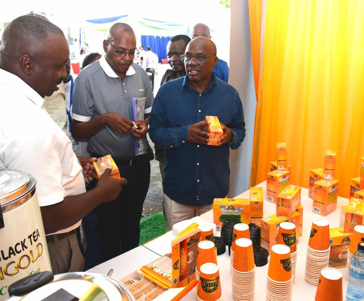 Agriculture PS Dr. Paul Ronoh (R) when he visited exhibition stands during the Tea Board of Kenya (TBK) centenary celebrations, Mombasa. Photo/Andrew Hinga
