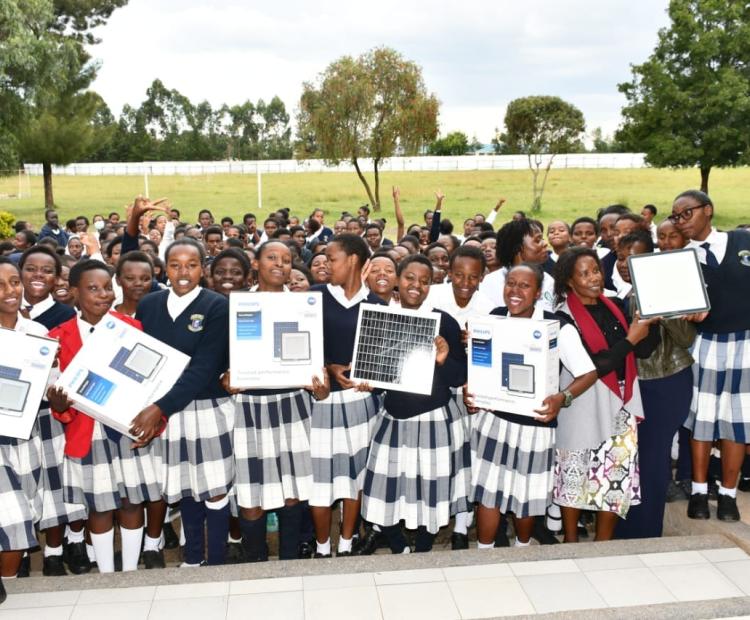 Students of Kirobon Secondary school in Rongai Sub-County celebrate after receiving efficient lighting equipment.