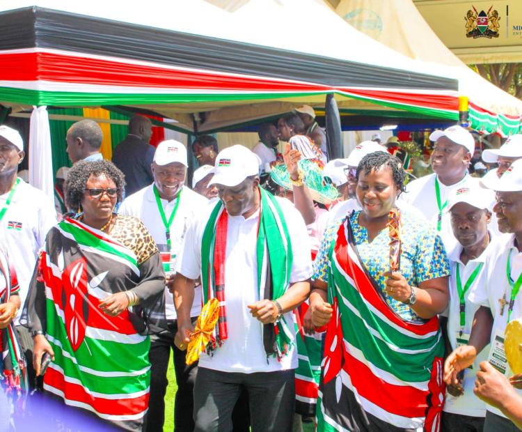 Cooperatives and MSMEs CS Wycliffe Oparanya (in white cap) joins Kenya exhibitors for a dance in Juba, South Sudan.