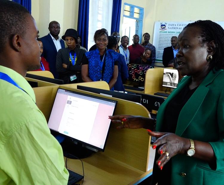 Technical and Vocational Education and Training (TVET) PS Dr. Esther Muoria, speaks to a student at the just commissioned gemology lab at Taita Taveta National Polytechnic at Voi