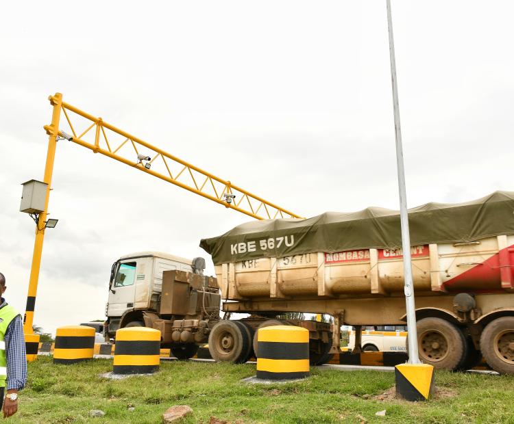 A long-distance cargo truck passes through one of the recently installed high-motion sensors to detect load weight and ensure compliance with strictly enforced load weight for both local and transit transporters at the Gilgil weighbridge. Photo/Erastus Gichohi.