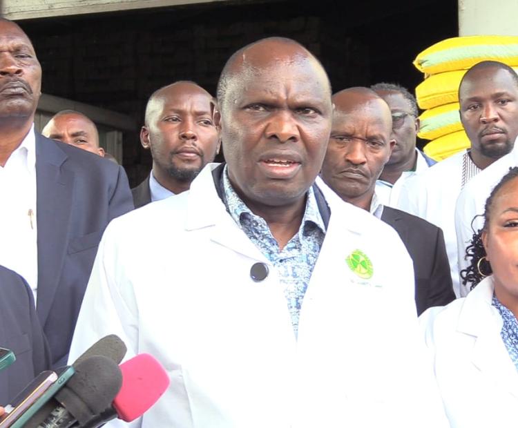 Head of Public Service and Chief of Staff Felix Koskei addressing the press in Kitale after visiting Kenya Seed Company stores. He was accompanied by Kenya Seed Company Board Chairperson Purity Ngirici (right)