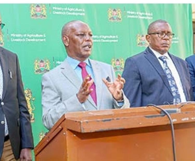 Former Agriculture and Livestock Development Cabinet Secretary (CS) Dr. Andrew  Karanja (second from left) speaking in Nairobi during a media breakfast engagement.  Photo/Gladys Njoka.