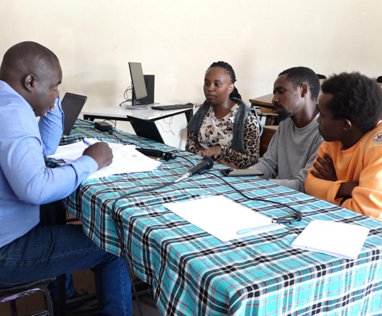 Senior research scientist at The Kenya Industrial Research and Development Institute  (KIRDI) attached to the Directorate of Technology Transfer and Extension Services Mr  Winstone Nyaguti (Left) takes young innovators on the training over to need to patent  their inventions.