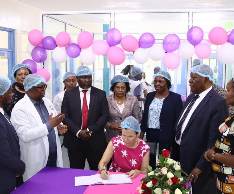 The President Catholic Medical Mission Board (CMMB), Madam Mary Beth Powers, while signing a visitor's book at Kitui county Referral hospital today during the inauguration of Maternal and Newborn Healthcare Unit at the hospital. Photos/Purity Mwendwa.