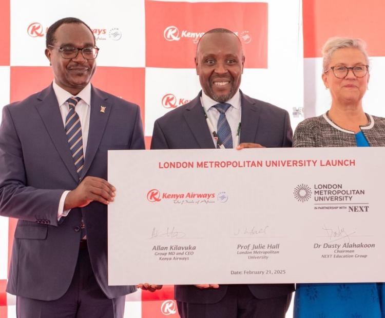 (From L to R) Cabinet Secretary for Education Julius Ogamba, Kenya Airways Chief  Executive Officer, Allan Kilavuka and The London Metropolitan University Vice-Chancellor  Julie Hall pause for a photograph after signing a partnership between Kenya Airways and  the London Metropolitan University at Pride Center in Embakasi, Nairobi.