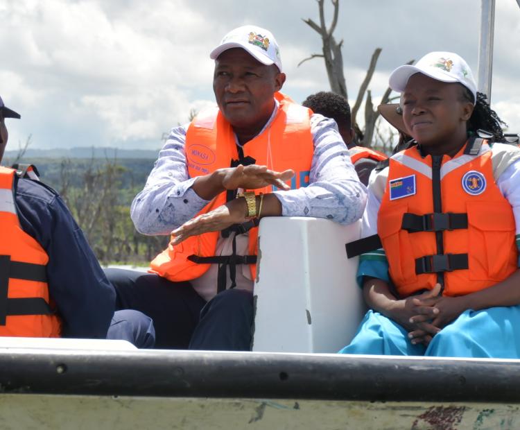 Environment, Climate Change and Forestry CS Dr. Deborah Mlongo Barasa and Nyandarua County Governor Moses Kiarie Badilisha (in white caps, both facing camera) 