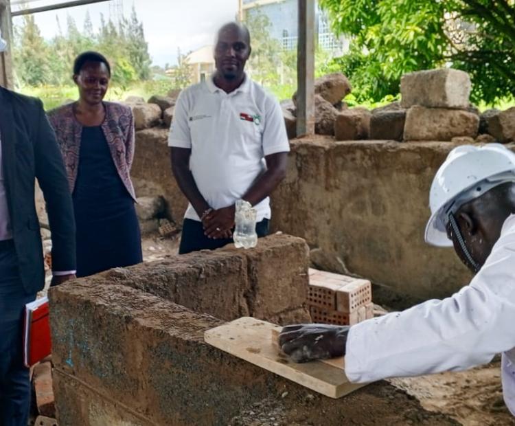Officers from the RPL Directorate overseeing a masonry test for one of the candidates  seeking certification at Kisumu National Polytechnic.