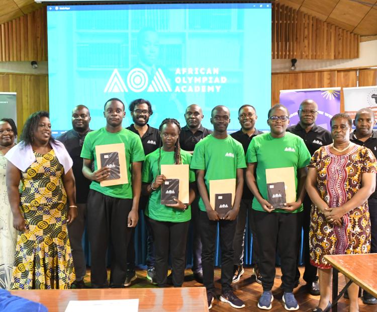Center for Mathematics, Science and Technology Education in Africa staff at the institution pose for a photograph with four math learners who have successfully won an education scholarship to Kigali, Rwanda. Photos/Bonface Malinda/KNA