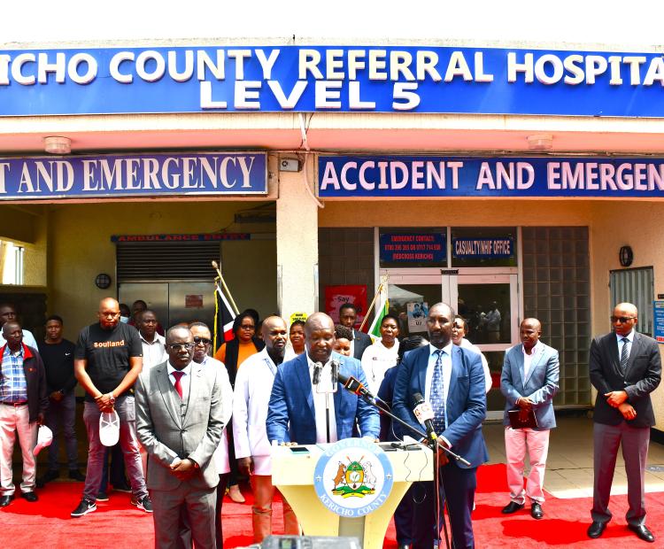 Kericho County Governor Dr. Eric Mutai during the  official handing over of the Kericho County Referral  Hospital to the contractor for the safe removal of  hazardous asbestos roofing and the construction of  a modern hospital kitchen. Governor Mutai is flanked  by County Executive Committee Member (CECM)  Dr. David Ekuwam (right), and Health Services Chief  Officer Dr. Japheth Cheruiyot (left).