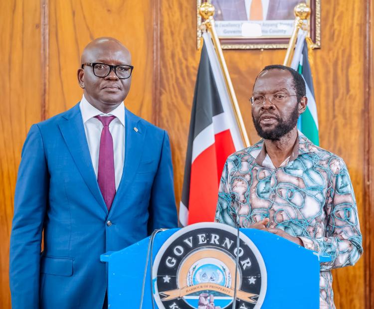 Kisumu Governor (right) and Equity Bank Managing Director (MD) Moses Nyabanda during the signing of the MOU in his office.  Photos/Chris Mahandara 