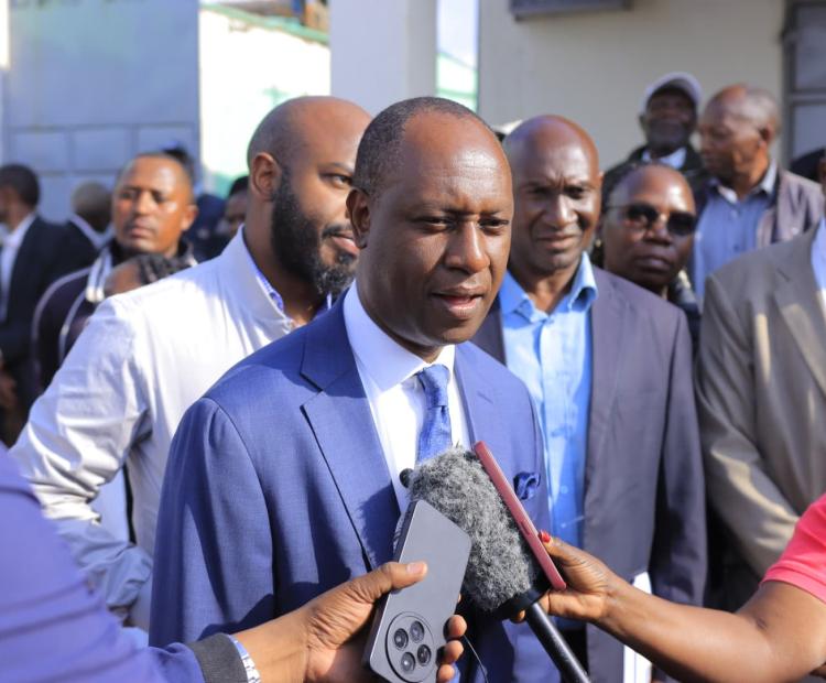 Livestock Development Principal Secretary, Jonathan Mueke, at Ndarugu Dairy Cooperative Society in Gatundu South Sub-county during the delivery of a 5,000 litres milk cooler 