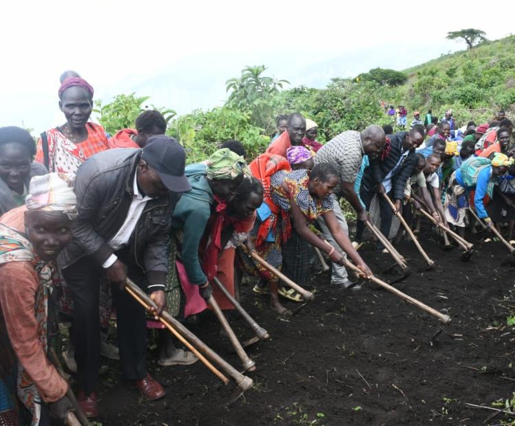 West Pokot Director of Peace,Rev,Jackson Alukusia (front third from left) joined hands with local communities to construct a vital road linking Chepkogogh location in West Pokot County to Kipchumwa location in Marakwet East Constituency, Elgeyo Marakwet County. Photo/Anthony Melly