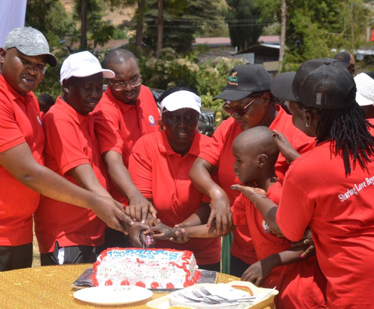 Cabinet Secretary (CS) for Gender, Culture and Children Services, Hanna Cheptumo, joins Baringo leaders in a cake cutting ceremony at Kabarnet School for deafblind 