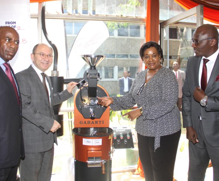 Turkish Ambassador Subutay Yuksel (2nd left) poses with officials during the handover of barista machines at Kenya Utalii College.