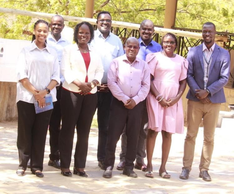 Turkana County Deputy Governor Dr John Erus (centre,front row) and officials from Swisscontact after a meeting to deliberate strategies to build capacity of local community to ensure they benefit from opportunities in the oil and gas sector. PHOTO: PETER GITONGA