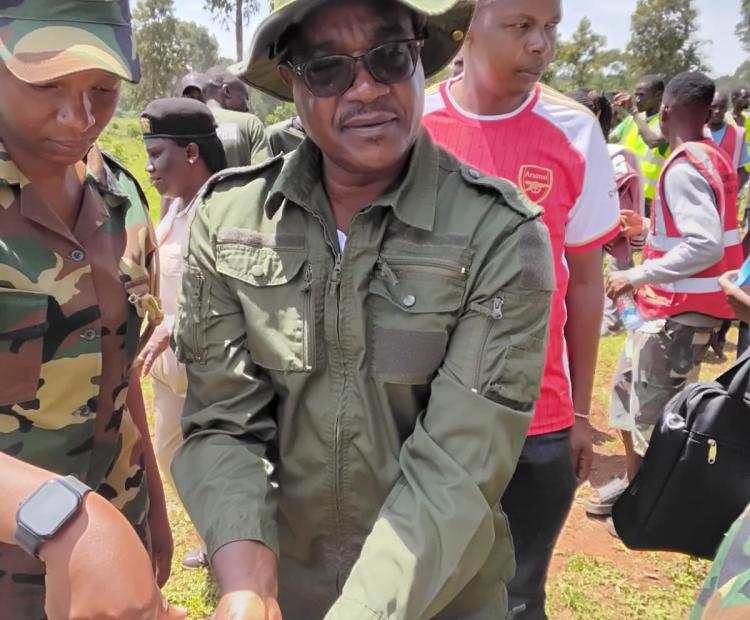 Education Cabinet Secretary Julius Migos Ogamba speaking after a tree planting exercise at Kitale Block C Forest as part of the national government’s campaign to restore forest