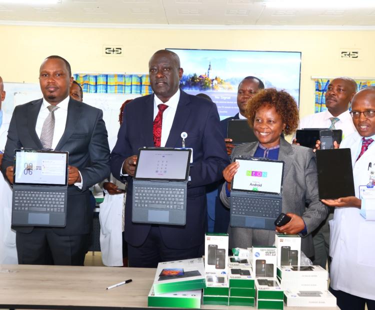 Kenyatta National Hospital Chief Executive Officer (CEO) Dr. Richard Lesiyampe (Centre) together with officials from the Digital Health Authority and Kenyatta National Hospital staff display the new digital health system known as the Taifa Afya Apex platform during its launch in Nairobi.