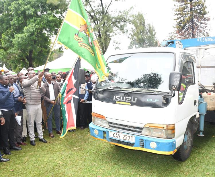 Principal Secretary for Livestock Development Jonathan Mueke flags off 12 government-supplied milk coolers at Moi Gardens in Kericho Town, he was joined by Kericho County Governor Dr. Eric Mutai, Senator Aaron Cheruiyot, Cooperative Union Chairman Moses Rotich, and other county and national leaders. PHOTO: KIBE MBURU